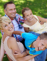 Image showing Garden, portrait and happy family relax on grass at home with care and love from parents for children. Mother, father and kids smile in backyard on holiday, vacation or together in summer on lawn