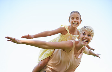 Image showing Mother, child and portrait with flying arms or outdoor game in nature for bonding fun, playing or blue sky. Female person, daughter and airplane hands for vacation connection, traveling or carefree