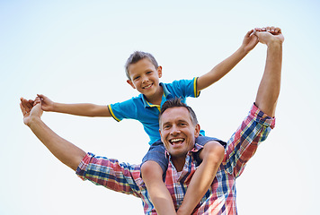 Image showing Dad, young boy and shoulders of parent, sky and outdoors in park with smile. Laugh, love and bonding with son and father with family, spring and carrying child in summer and spending time together