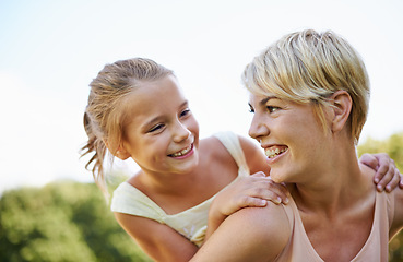 Image showing Piggyback, happiness and mom with kid to play outdoors for bonding, love and support in garden for mothers day. Parent, daughter and together with care for summer fun in backyard with shoulder game.