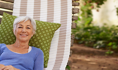 Image showing Senior woman and smile in garden with hammock to relax for retirement, break and enjoy. Portrait, female person and happy at home in summer or hot weather for outdoor and .satisfied with me time.