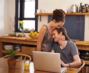 Image showing Home, couple and typing with laptop, hug or email with online reading, breakfast or research. Planning, apartment or dreadlocks with man or woman with computer or internet with tech, smile or embrace