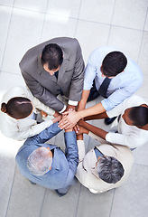 Image showing Business people, together and huddle for hands in pile, community and support or unity. Colleagues, team and agreement in collaboration or alliance in workplace, solidarity and above for cooperation