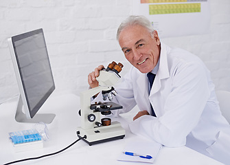 Image showing Doctor, portrait and microscope in laboratory for research, medical development or bacteria test. Mature scientist, healthcare and smile with technology for dna sample, innovation and growth in study