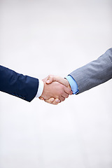 Image showing Closeup, business people and shaking hands for partnership deal, collaboration and b2b agreement for consultant. Welcome, introduction and handshake in studio isolated on a white background mockup