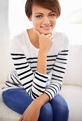 Image showing Home, fashion and portrait of happy woman to relax on sofa in lounge on vacation or holiday. Calm, break and girl with smile in casual clothes or pride for style in apartment on couch in living room