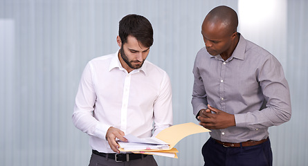 Image showing Men, document or business in office, conversation or exchange of idea for planning, work or project. Businessmen, paper or point to discuss or explain for professional, corporate or teamwork