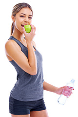 Image showing Happy woman, portrait and apple with water for healthy eating, diet or fitness on a white studio background. Female person or athlete with mineral drink, green organic fruit or food on mockup space