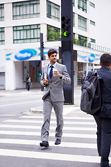 Image showing Businessman, coffee and newspaper in city for business, walking and commute to work. Professional, male person and expresso for caffeine, energy and article for news, cappuccino and man in New York