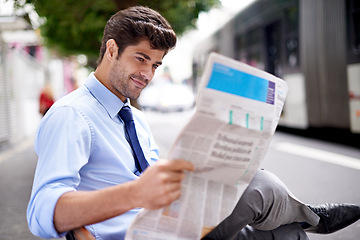 Image showing Professional, businessman and reading newspaper for information, daily news and updates on local events. Outdoors, male person and smile with article for stories, journalism and newsletter in city