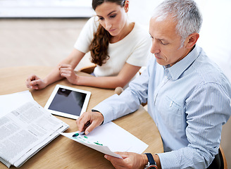 Image showing Meeting, man and woman in office with paperwork for sales review, stats growth or development. Planning, strategy and business people at desk with tablet, newspaper and data analysis on profit trends