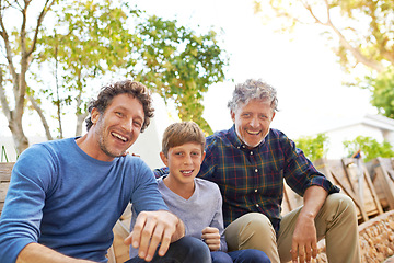 Image showing Boy, dad and grandfather in portrait in backyard with smile, support and outdoor bonding together. Men, family and face of happy child with generations in green garden for nature, weekend and plants