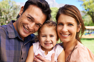 Image showing Happy family, parents and portrait with child in park for bonding, healthy relationship and relax on Saturday. Smile, father and mother with daughter for selfie in nature, dad and mom with young girl