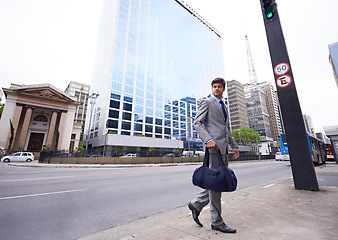 Image showing Business man, city and bag for commute outdoors, employee and travel to work or company. Male person, professional lawyer and duffel in downtown, attorney and journey to law firm or office building