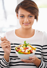 Image showing Woman, salad and healthy food in portrait for diet with detox, breakfast and lunch at home. Young person eating vegetables, lettuce and green fruit or vegan meal in bowl for nutrition and wellness