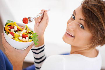 Image showing Woman, salad and happy portrait with healthy food for diet, detox and breakfast on sofa at home. Person relax and eating vegetables, lettuce and green or vegan meal in bowl for nutrition and wellness