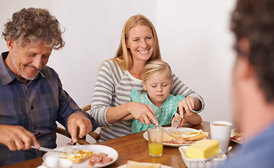 Image showing Parents, child and home for breakfast on happiness in morning for bonding with conversation, support and care. Family, kid and guest for meal to eat with coffee in table for fun, enjoy and together.