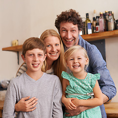 Image showing Parents, family and portrait with children in kitchen for holiday relax or together for weekend, good mood or bonding. Mother, father and siblings or face in apartment for happy, vacation or break