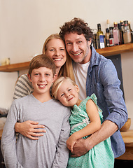 Image showing Family, portrait and hug in kitchen with smile, love and security at home for bonding. Mother, father and children with happiness and affection, people with support and trust for healthy relationship