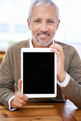 Image showing Portrait, tablet screen and happy man or manager showing mockup space at desk in office for marketing business. Face, display and person with technology for advertising or promo of mature consultant