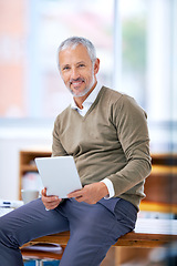Image showing Portrait, smile and businessman with tablet in office for website research on internet. Happy, reading and mature financial planner work on budget project with digital technology in workplace.