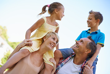 Image showing Smile, parents and carrying children in park, shoulders and quality time in nature. Love, fun and joyful with happy mother and father on holiday relax, spring and carefree with family on vacation