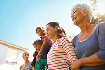 Image showing Outdoor, house and grandmother with family in summer on holiday or vacation in retirement with support. Happy, senior woman and relax with kids and parents in backyard with care for generations