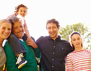 Image showing Family, portrait and smile in outdoor nature, love and bonding together or happy in backyard. Generations, relax and peace or care for support in garden or park, vacation and summer holiday in France