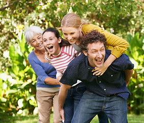 Image showing Family, fun and playing in outdoor nature, love and bonding together or happy in backyard. Generations, smile and laugh or game for humor in garden or park, vacation and summer holiday in France