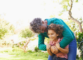Image showing Child, man or hug to relax in park, idea or memory of interracial adoption as fun, play or bonding. Boy, dad or smile in thinking of trust, support or together in happy hangout in sunny garden