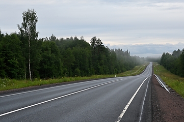 Image showing empty country road on a foggy evening