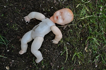 Image showing old broken plastic doll 