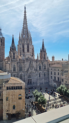 Image showing BARCELONA, SPAIN - APRILL 4, 2024: Grand cathedral towering over city