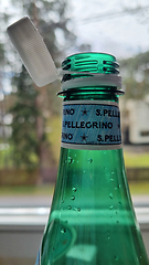 Image showing TALLINN, ESTONIA - MAY 12, 2024: Close-up of San Pellegrino bottle with cap slightly open. European Union directive aimed at reducing plastic waste