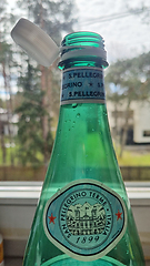 Image showing TALLINN, ESTONIA - MAY 12, 2024: Close-up of an open San Pellegrino bottle in daylight. European Union directive aimed at reducing plastic waste
