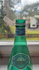 Image showing TALLINN, ESTONIA - MAY 12, 2024: Close-up of a San Pellegrino bottle on a window sill. European Union directive aimed at reducing plastic waste