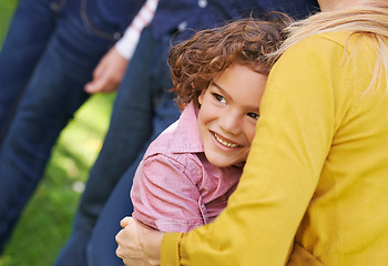 Image showing Kid, woman or hug as thinking of family, support or safety as vision of trust, bonding or together. Boy, mother or idea of happy, outing or memory of care as protection in park on summer afternoon