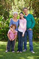 Image showing Grandparents, portrait and hug in outdoors, children and bonding together or happy in backyard. Senior people, kids and peace or embrace for support in garden or park, vacation and holiday in France