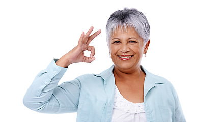 Image showing Portrait, senior woman and ok sign with agreement, smile and model isolated on white studio background. Face, mature person and pensioner with hand gesture and symbol for perfect, support or feedback