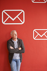 Image showing Email icon, thinking and senior man with arms crossed, ideas and employee on red studio background. Mature person, model or entrepreneur with planning and symbol for communication, choice or envelope