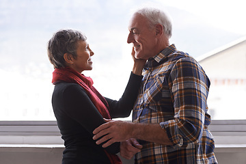 Image showing Mature couple, love and commitment in home or house, vacation and retirement holiday with happiness. Smile, elderly people and marriage or relationship for bonding, care and romance of woman and man