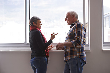 Image showing Window, mature couple and communication with smile, conversation and discussion of retirement holiday. House, elderly people and marriage for bonding, commitment and planning for romantic vacation