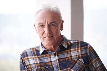 Image showing Portrait, retirement and senior man in home to relax in apartment alone by window in Australia. Face, elderly and male person with confidence or handsome pensioner in casual clothes at nursing house