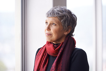 Image showing Thinking, nostalgia and mature woman in window with memory, moment and reflection in home. Remember, face and elderly female in living room for thoughts, vision and feeling lonely in retirement