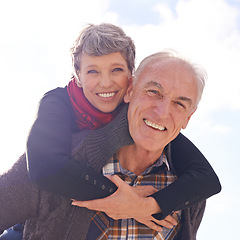 Image showing Portrait, mature couple and piggyback or love on vacation, retirement holiday and celebrate with smile. Happy, elderly people and marriage or commitment for bonding, care and romance in relationship