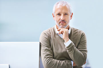 Image showing Businessman, portrait and hand on chin in office for finance career, accounting and confidence. Mature employee, monitor and professional manager with pride for corporate job, company and work