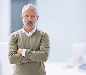 Image showing CEO, portrait and confident businessman with arms crossed in office, startup company or creative agency. Designer, entrepreneur and face of mature man for professional, career or management