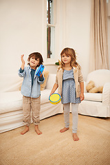 Image showing Home, portrait and tambourine with boy and girl for fun, childhood and bonding together for family with music game. Children, siblings and play in living room with smile for noise and entertainment.