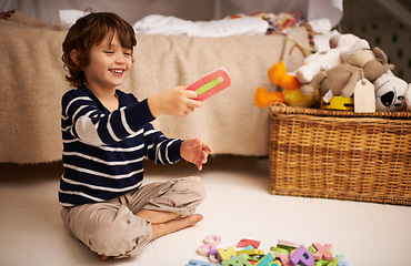 Image showing Boy, child and happy with letter toys to learn, development and games in bedroom at home. Excited, education and growth in childhood with alphabet, language and kid playing for fun at family house