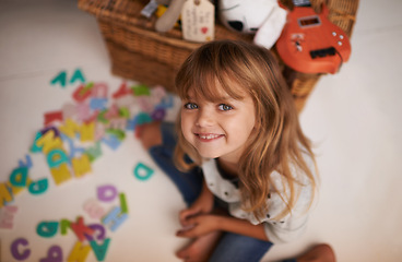 Image showing Girl, child and smile with letter toys for learning, development and games in playroom at home. Portrait, education and growth in childhood with alphabet, language and happy kid playing for fun